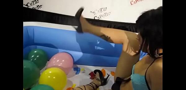  Teen pops balloons inside pool at Exxxotica